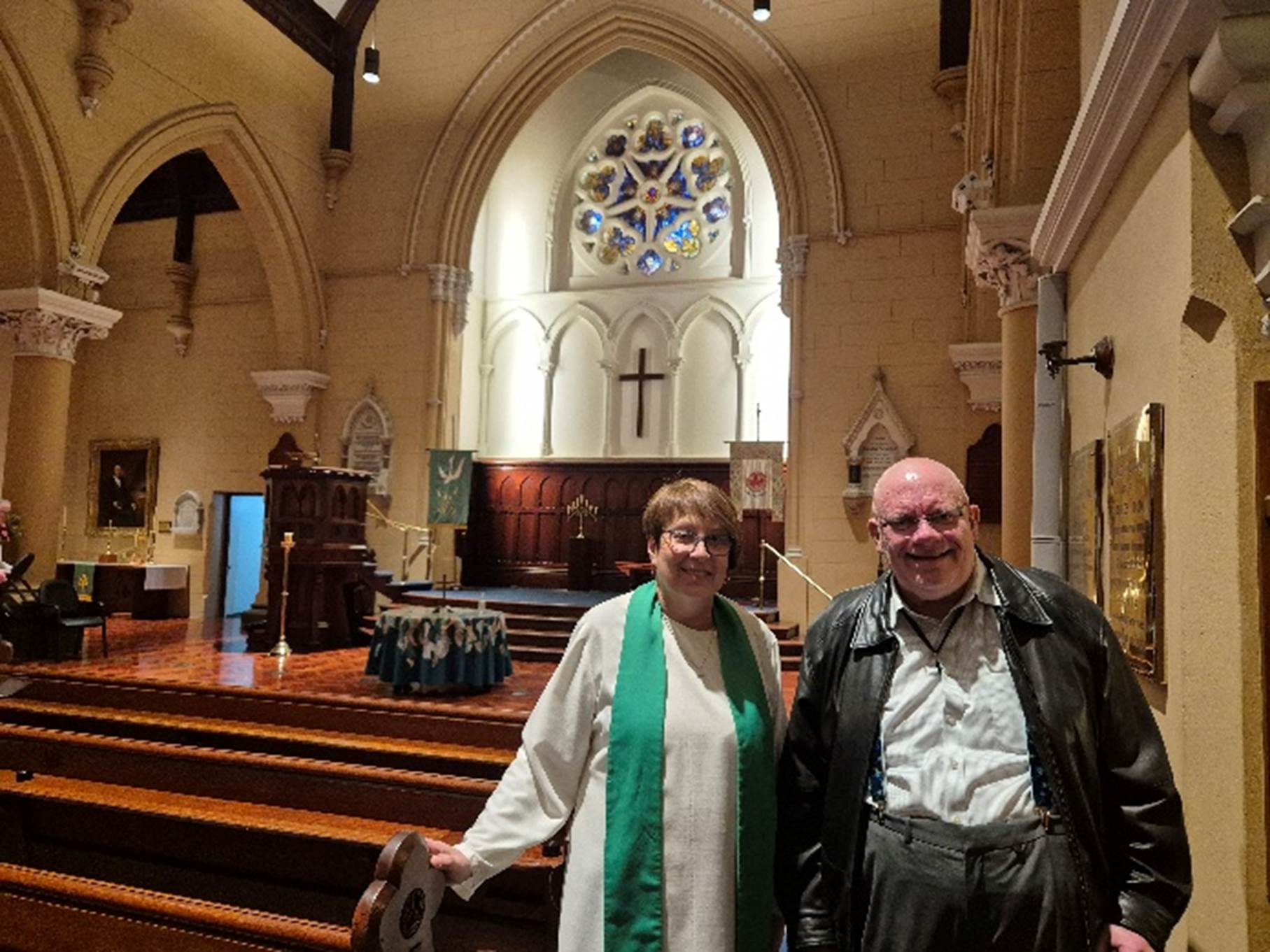 A person and person standing in a church

AI-generated content may be incorrect.