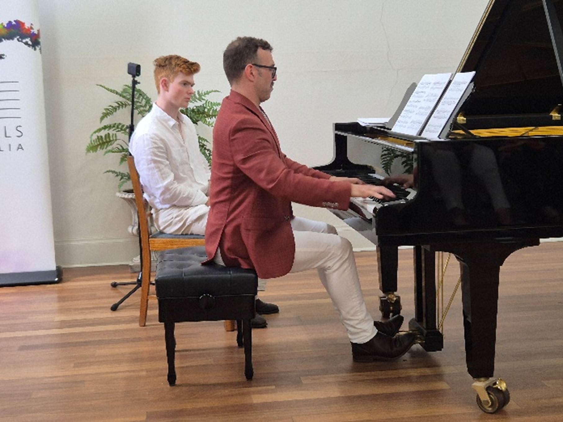 A person playing a piano

AI-generated content may be incorrect.