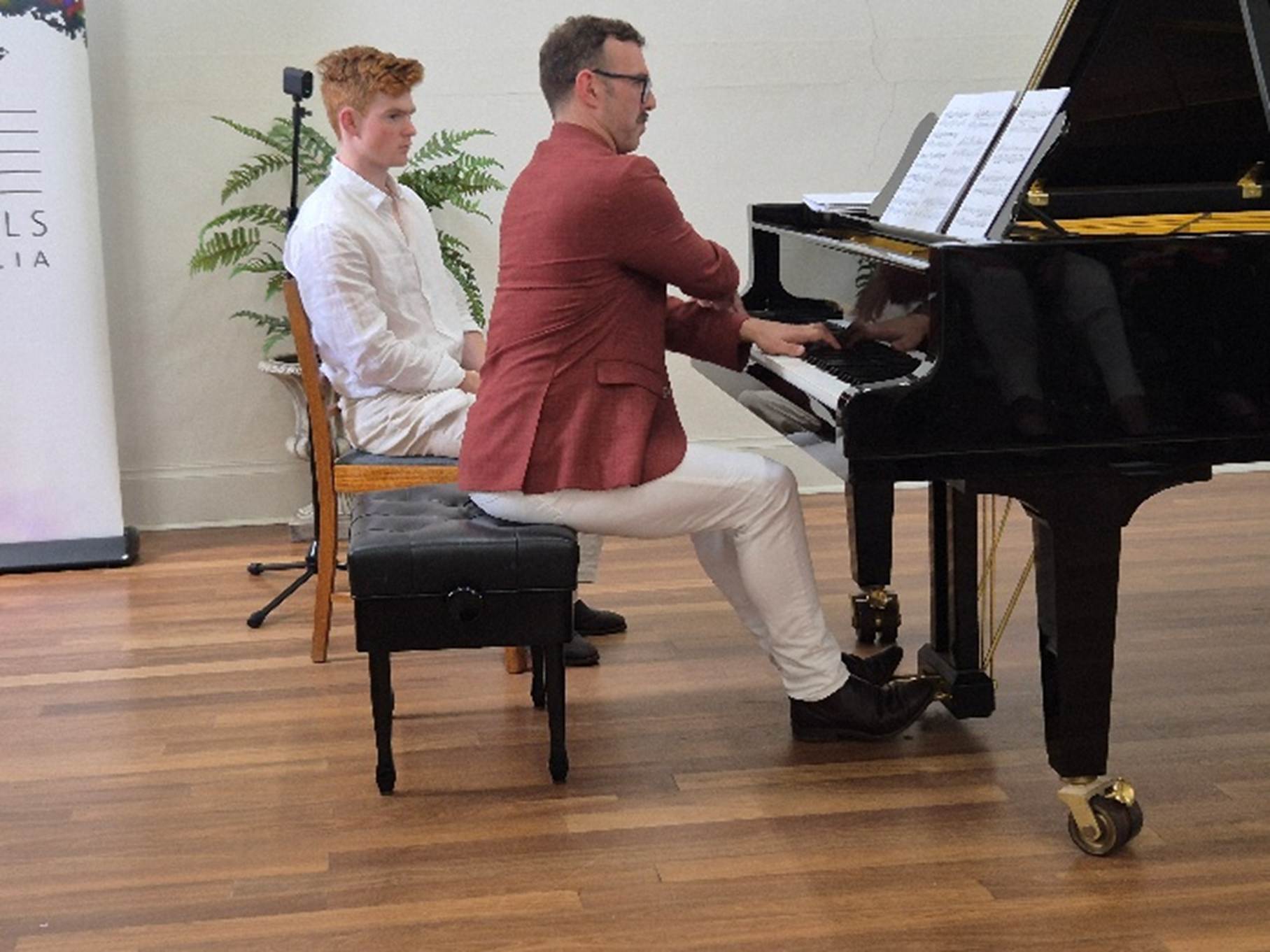 A person playing a piano

AI-generated content may be incorrect.